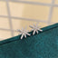 Round Cut Eight-Pointed Star Created Diamond Stud Earrings